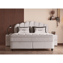 Lit Cali — Boxspring velours à tête galbée